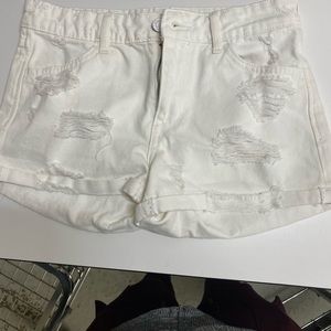 White ripped shorts